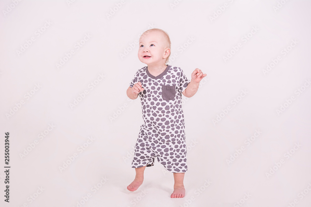 a little baby walks on a white background a little baby walks on a white background