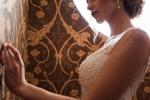 Morning of the bride when she wears a beautiful dress, woman getting ready before wedding ceremony 