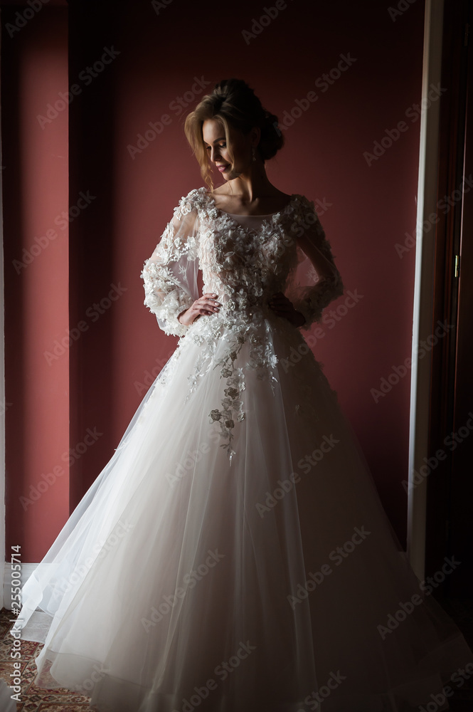 Morning of the bride when she wears a beautiful dress, woman getting ready before wedding ceremony Morning of the bride when she wears a beautiful dress, woman getting ready before wedding ceremony