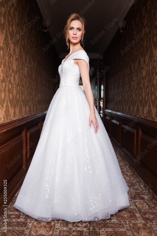 Bride.Young fashion model with perfect skin and make up brown background curly hair Bride.Young fashion model with perfect skin and make up brown background curly hair