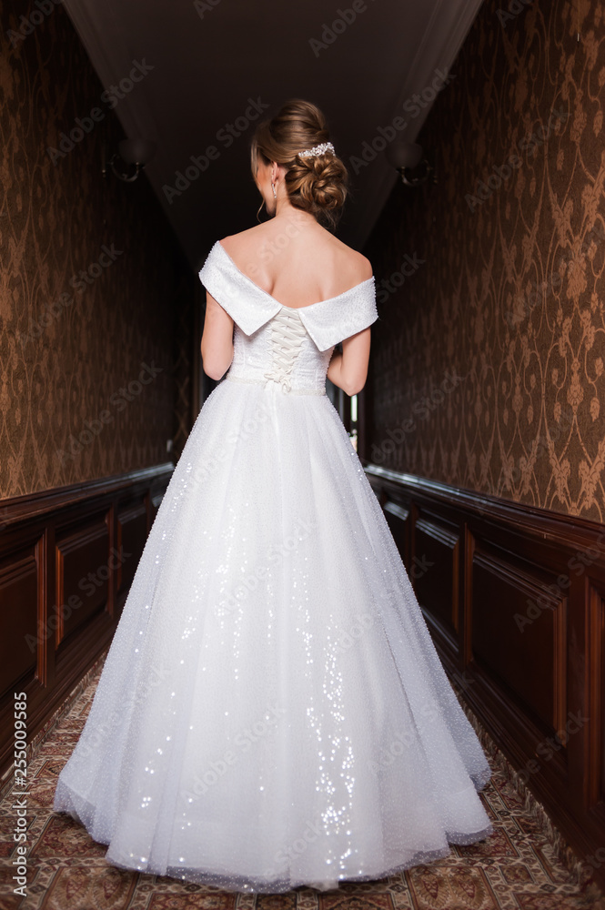 Bride.Young fashion model with perfect skin and make up brown background curly hair Bride.Young fashion model with perfect skin and make up brown background curly hair