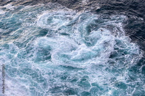 Background of the sea. Waves with foam top view