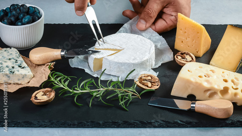 Food banner, cheese with blue mildew, Camembert or brie cheese circle, gouda on wooden background. Flat top view from above. copy space, set