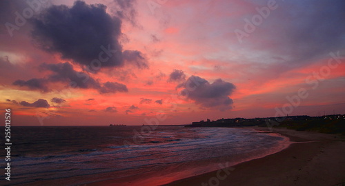 Cloudy sunrise on Tynemouth Longsands beach photo