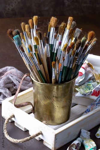 Paint brushes and paints for drawing.