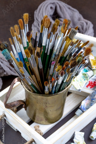 Paint brushes and paints for drawing.