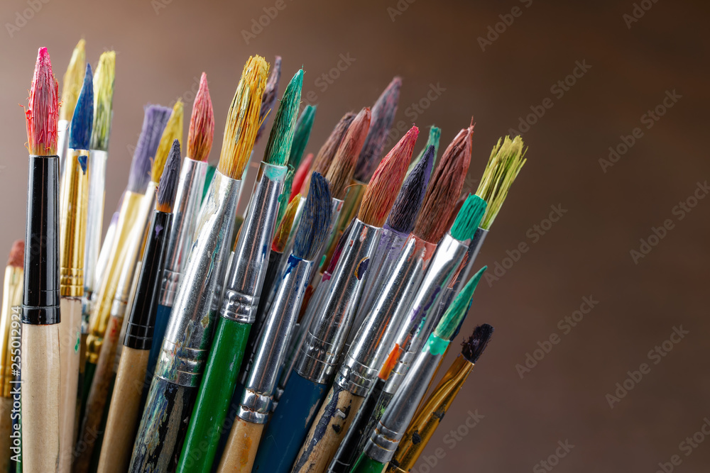 Paint brushes and paints for drawing.