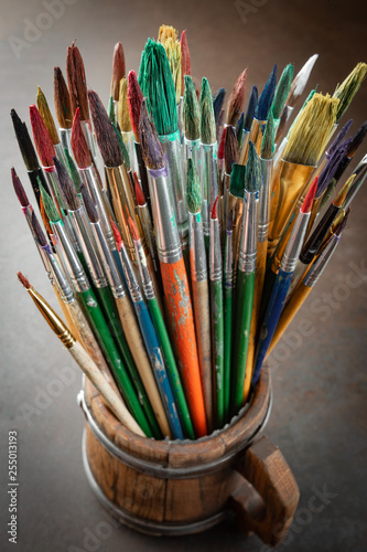 Paint brushes and paints for drawing.