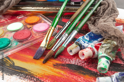 Paint brushes and paints for drawing.