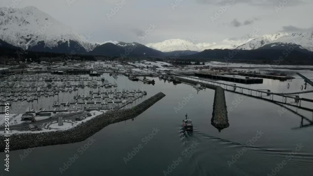 Commercial halibut fishing boat traveling Resurrection bay and the port