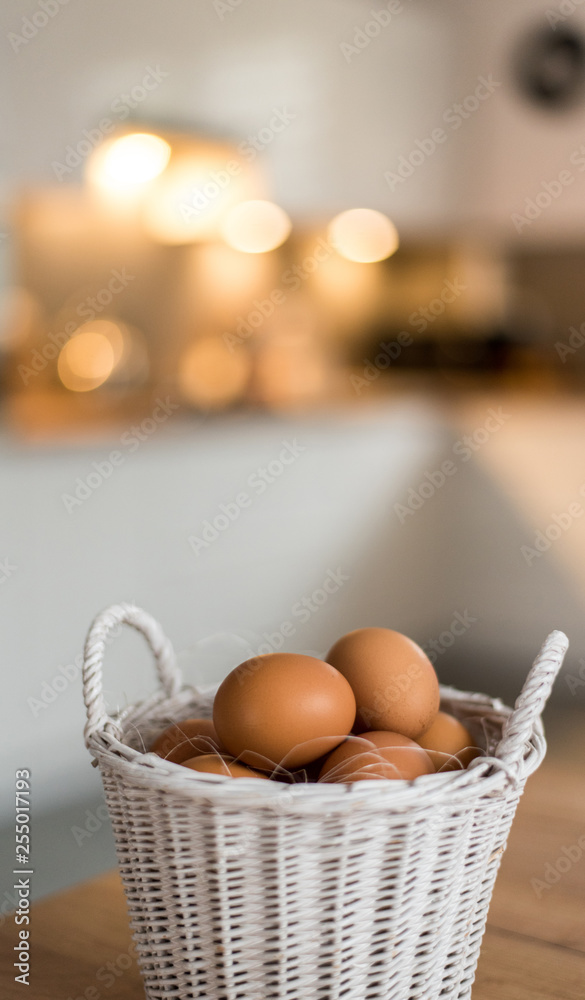 Fresh eggs in wicker basket on wood table Prepare chicken eggs and egg whisk for cooking or bakery can use for background or wallpaper. Fresh eggs in wicker basket on wood table Prepare chicken eggs and egg whisk for cooking or bakery can use for background or wallpaper.