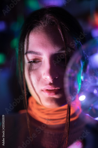 woman in black dress on street of city at night