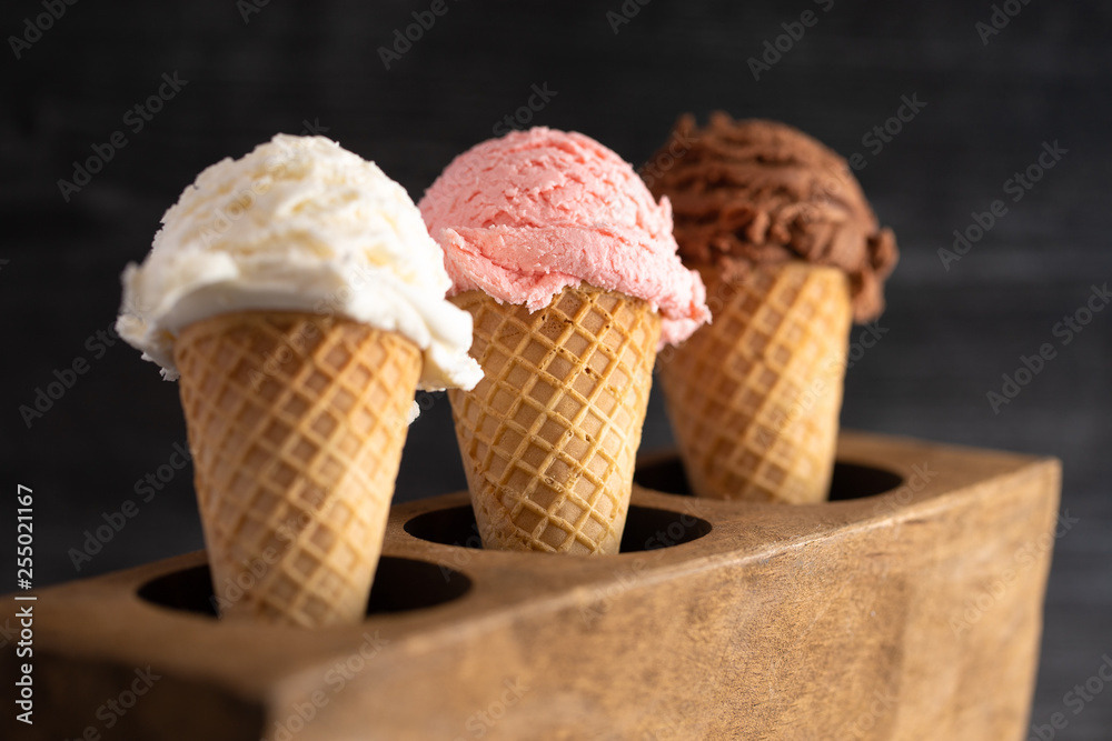 A Line of Three Classic Flavors of Ice Cream in a Wooden Sugar Mold A Line of Three Classic Flavors of Ice Cream in a Wooden Sugar Mold