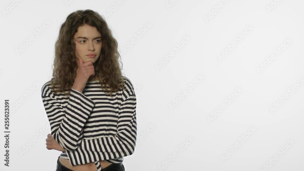 Thoughtful woman looking at white background. Pensive girl thinking product Thoughtful woman looking at white background. Pensive girl thinking product