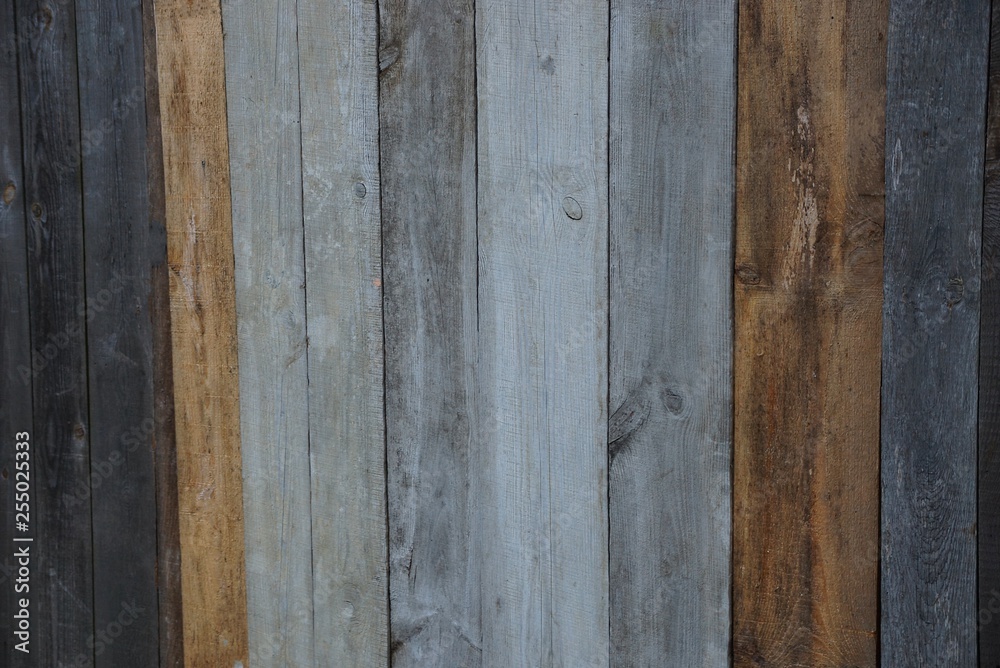 colored gray brown wooden texture from old boards in the wall of the fence