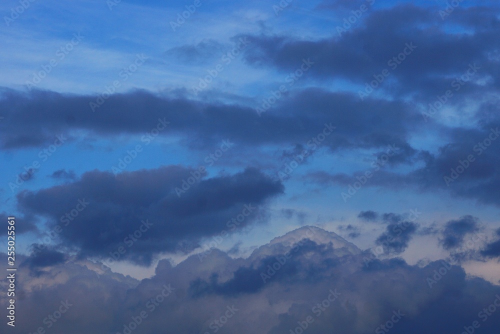 Fototapeta premium gray black clouds in the blue evening sky