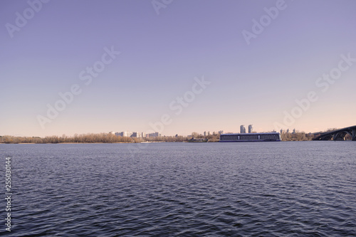 View of the river, dry forest and blue sky.