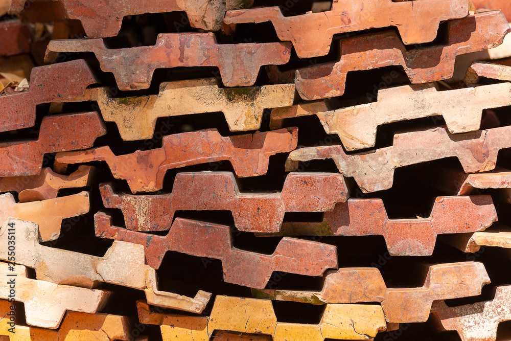 Stack of Old Orange Roof Tiles for construction