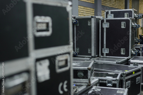 Stage equipment behind the scenes. Concert activity. Cases for transportation of equipment. Boxes on the wheels.