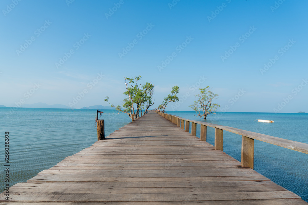 Obraz premium Wooden pier with boat in Phuket, Thailand. Summer, Travel, Vacation and Holiday concept.