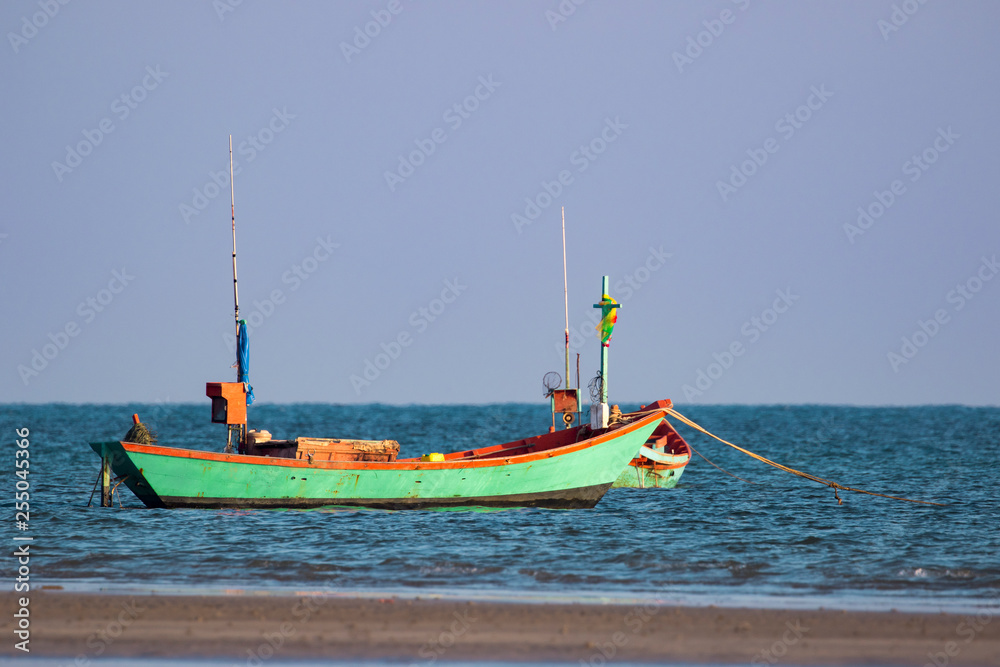 Fototapeta premium Image of small boat fishing on the sea.