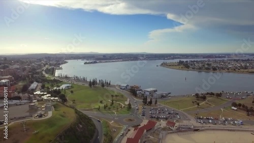 Aerial drone high shot of the city of Newcastle, revealing beach, harbour, Fort Scratchley and docks photo