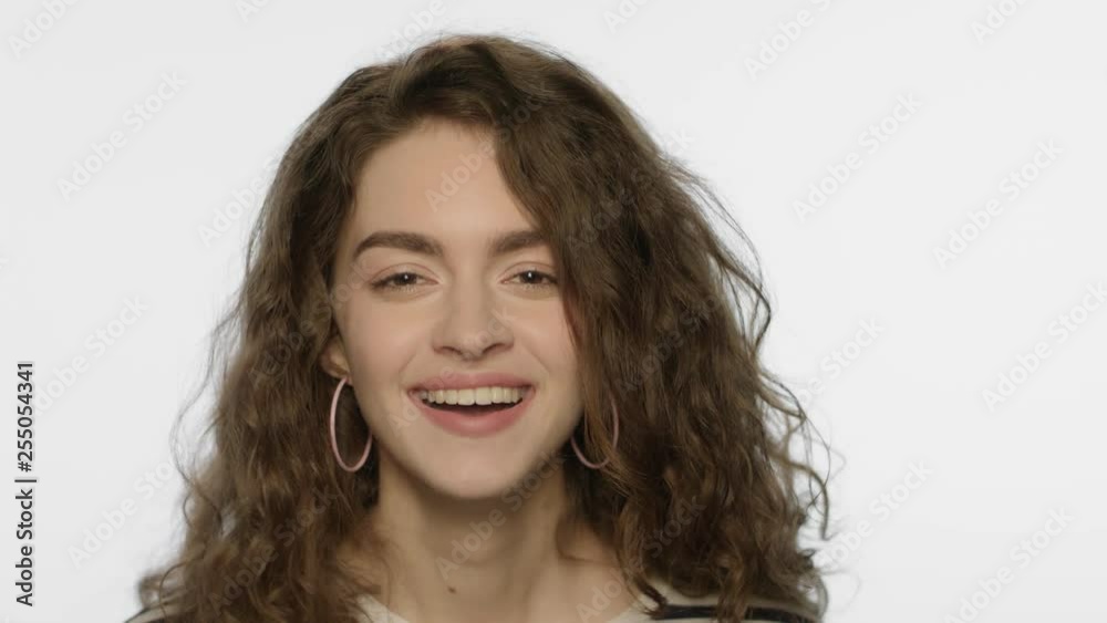 Happy girl jumping in white studio. Portrait of happy woman jump on white Happy girl jumping in white studio. Portrait of happy woman jump on white