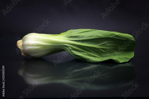 choy sum isolated black background