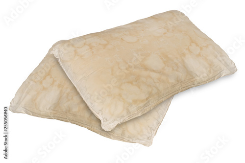 Dirty old pillow from saliva stain isolated on white background.
