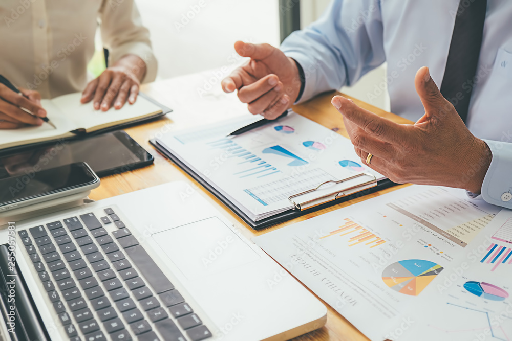 Business advisor analyzing financial figures denoting the progress Internal Revenue Service checking document. Audit concept Business advisor analyzing financial figures denoting the progress Internal Revenue Service checking document. Audit concept