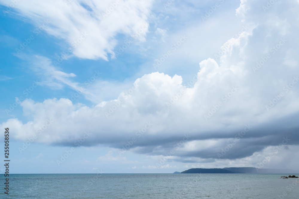 Enormous raining cloud floating in the sky over island in the evening in Koh Mak Island in Trat, Thailand.