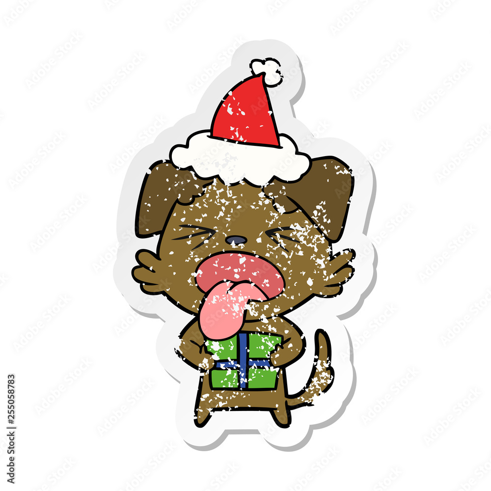 distressed sticker cartoon of a dog with christmas present wearing santa hat distressed sticker cartoon of a dog with christmas present wearing santa hat