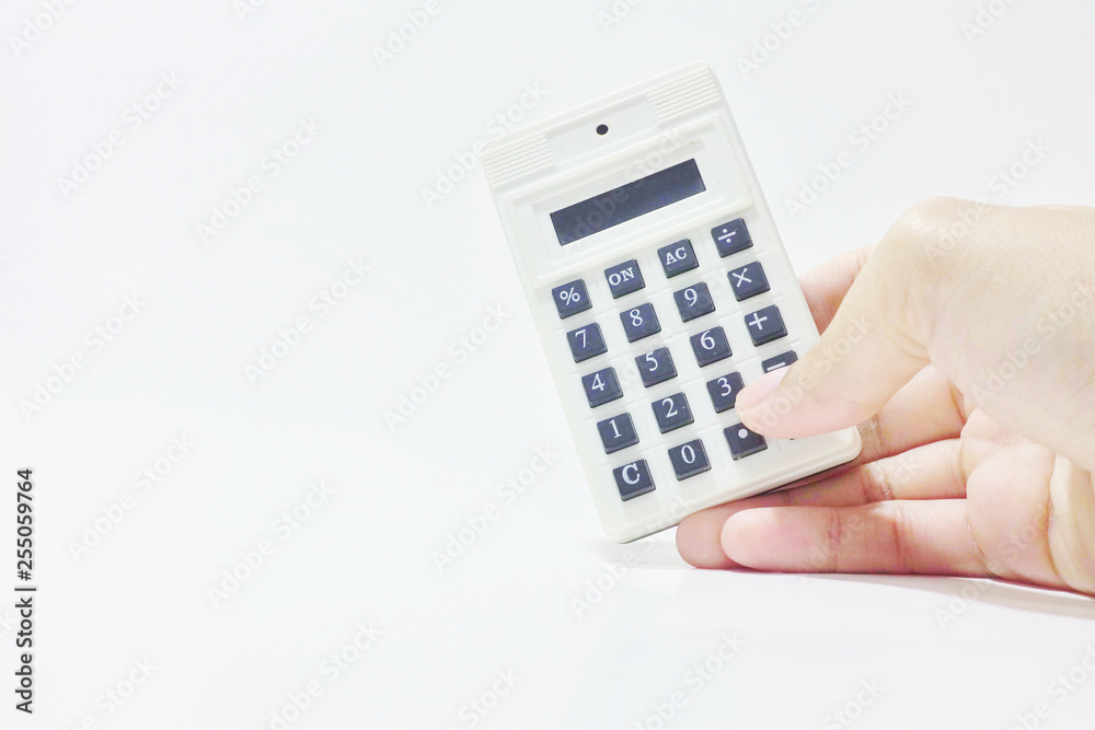 Woman right hand holding white calculator on white background Woman right hand holding white calculator on white background