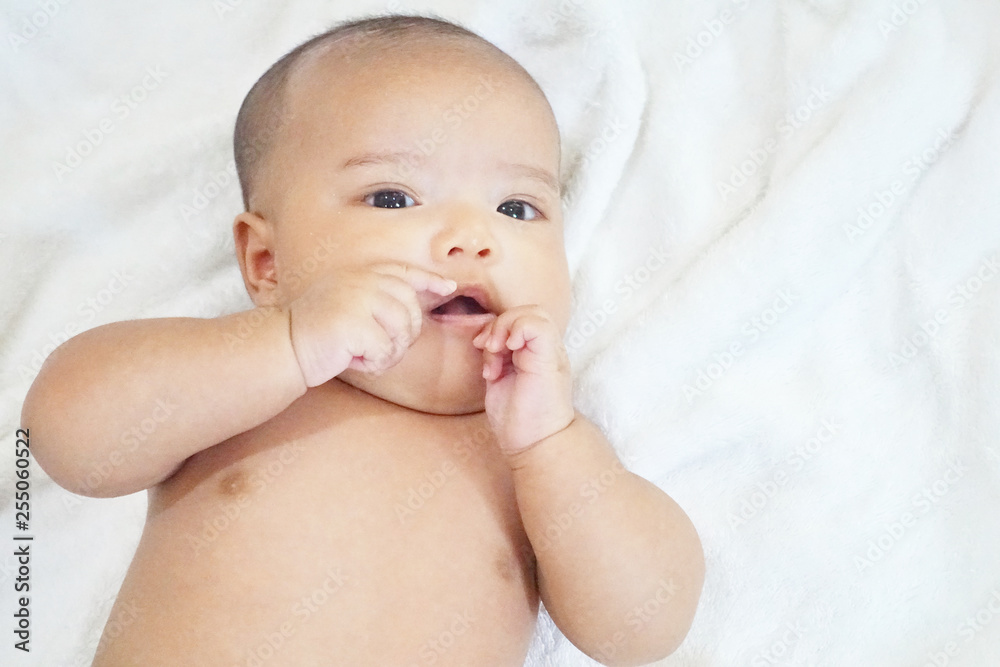 Newborn baby girl on white towel after done shower Newborn baby girl on white towel after done shower