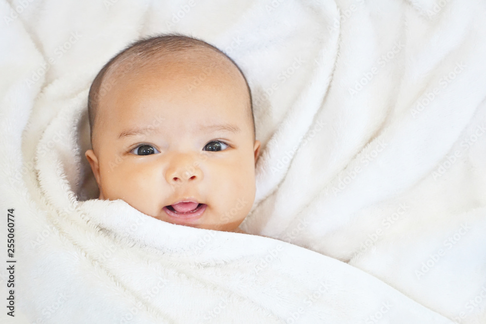 Newborn baby girl on white towel after done shower Newborn baby girl on white towel after done shower