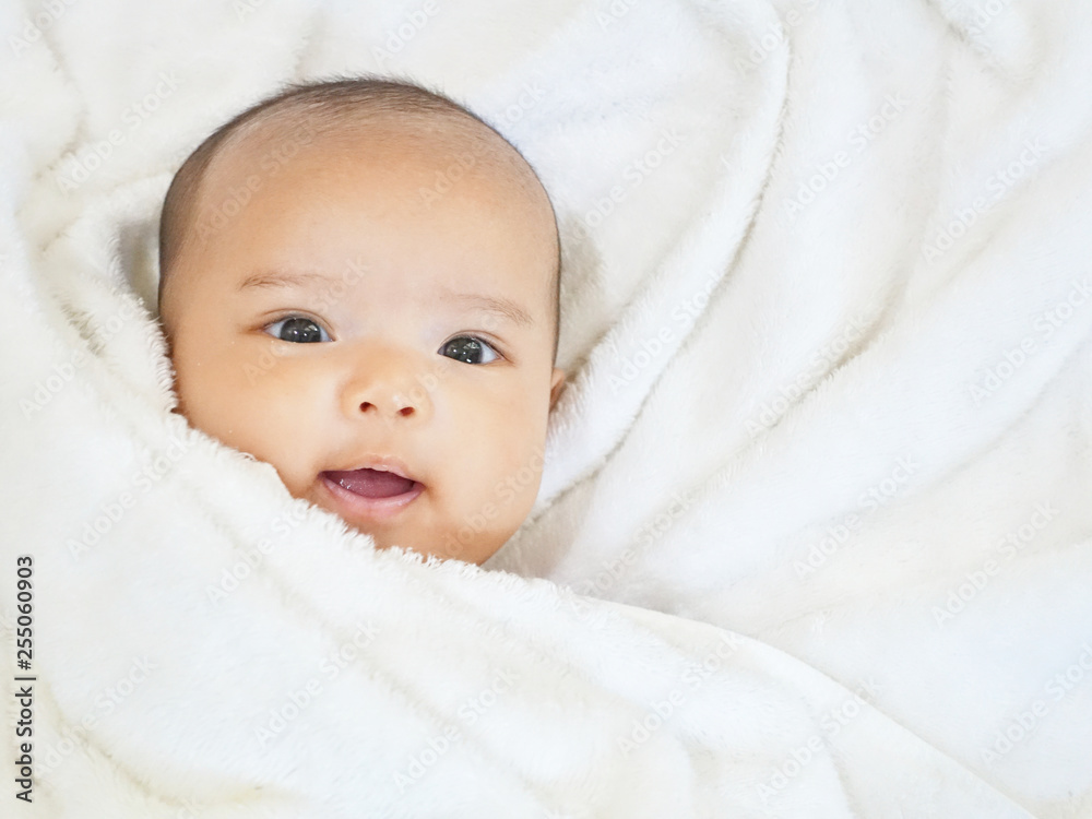 Newborn baby girl on white towel after done shower Newborn baby girl on white towel after done shower