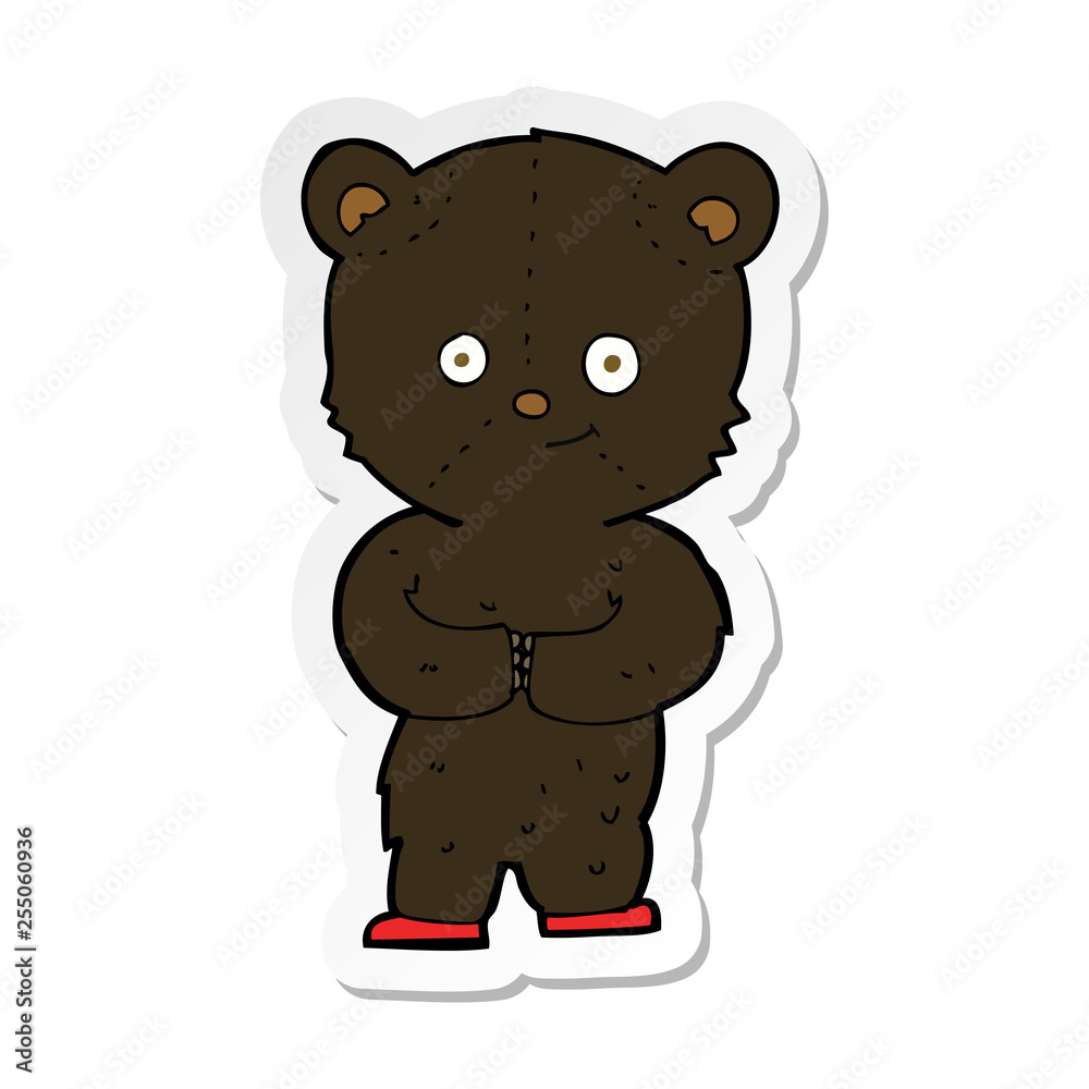 sticker of a cartoon teddy black bear cub sticker of a cartoon teddy black bear cub