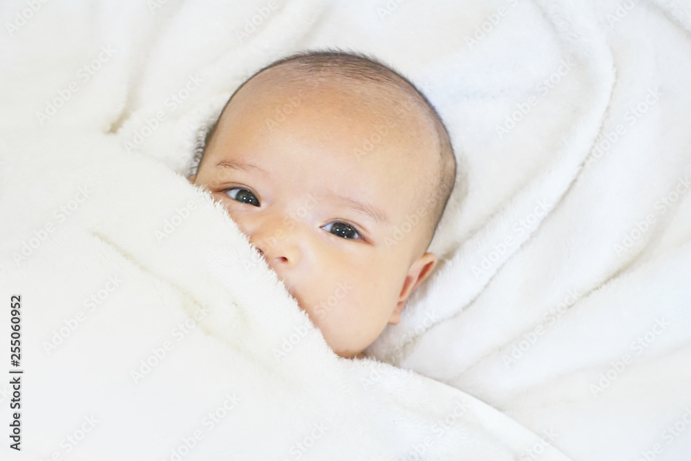 Newborn baby girl on white towel after done shower Newborn baby girl on white towel after done shower
