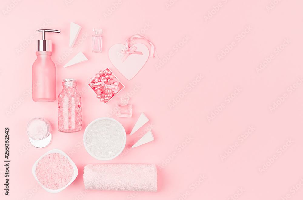 Modern exquisite set of cosmetic products and accessories in pastel pink color, copy space, flat lay. Modern exquisite set of cosmetic products and accessories in pastel pink color, copy space, flat lay.
