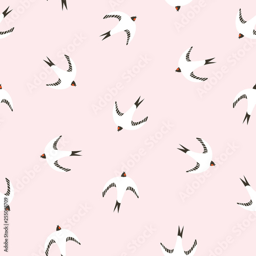 Beautiful seamless pattern with swallows. Vector illustration. Birds repeated background for baby fabric design.