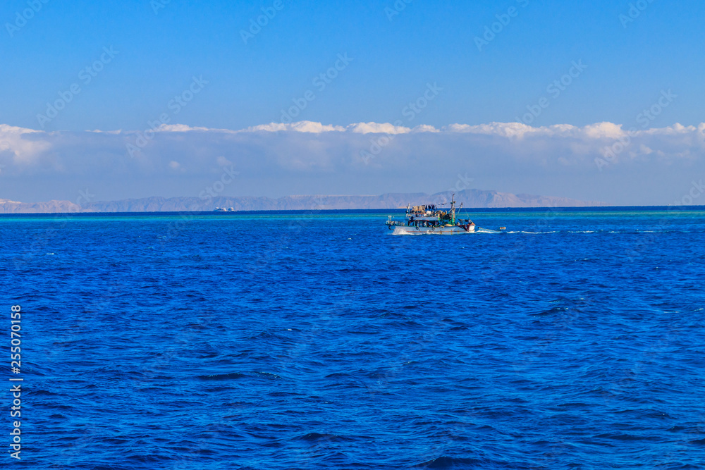 Fishing trawler sails at Red sea in Hurghada, Egypt