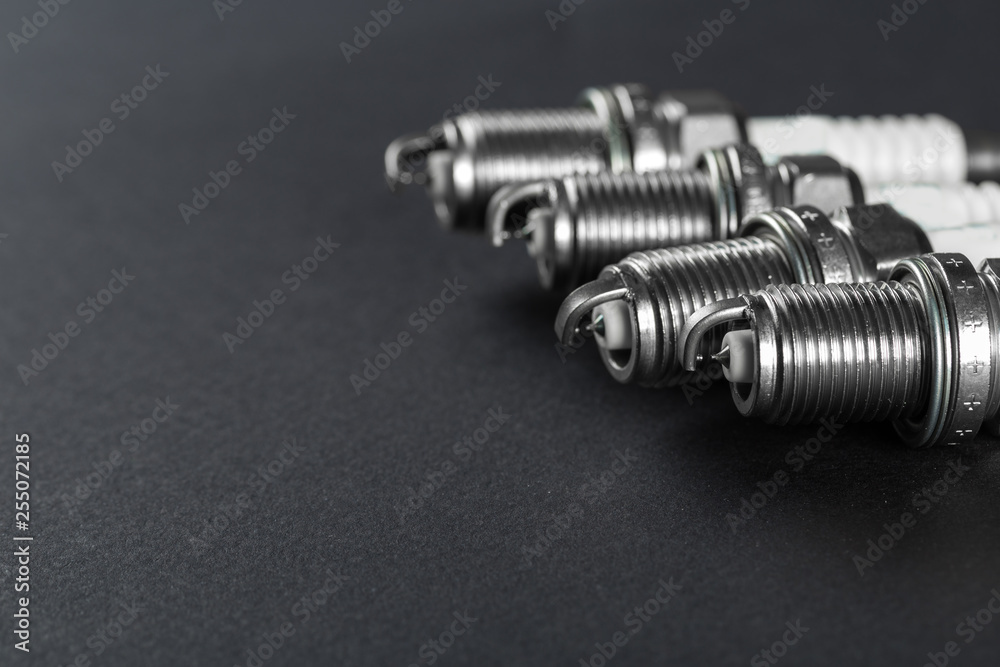 Spark plugs on black background Spark plugs on black background