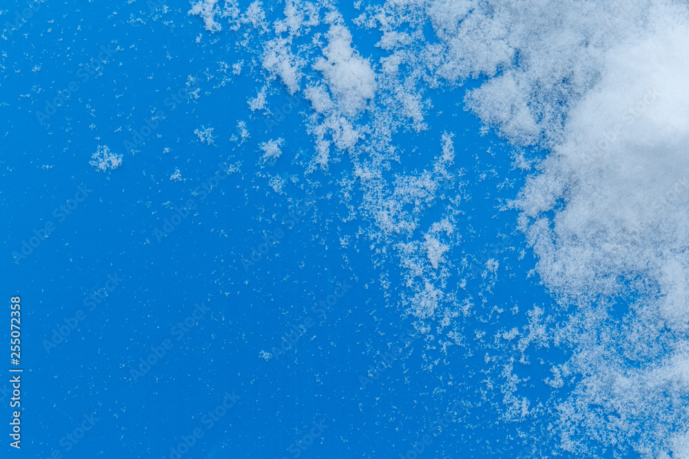 White snowy fields under a blue background