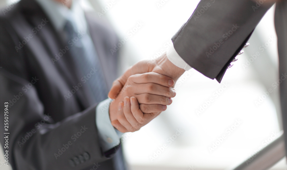 close up.business handshake on blurred office background