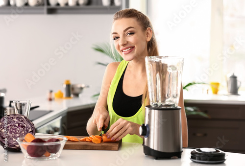 Smiling young woman prepari...