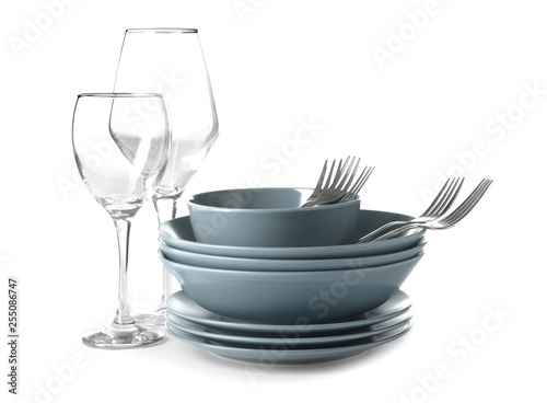 Set of clean dishes on white background photo