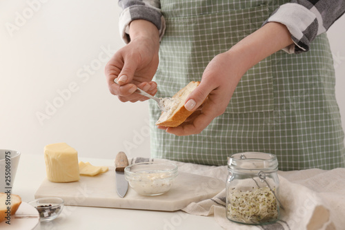 Woman preparing tasty bruschettas photo