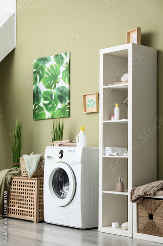 Interior of home laundry room with modern washing machine