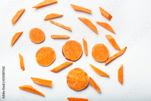 Cut sweet potato on white background