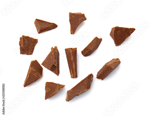 Pieces of tasty milk chocolate on white background